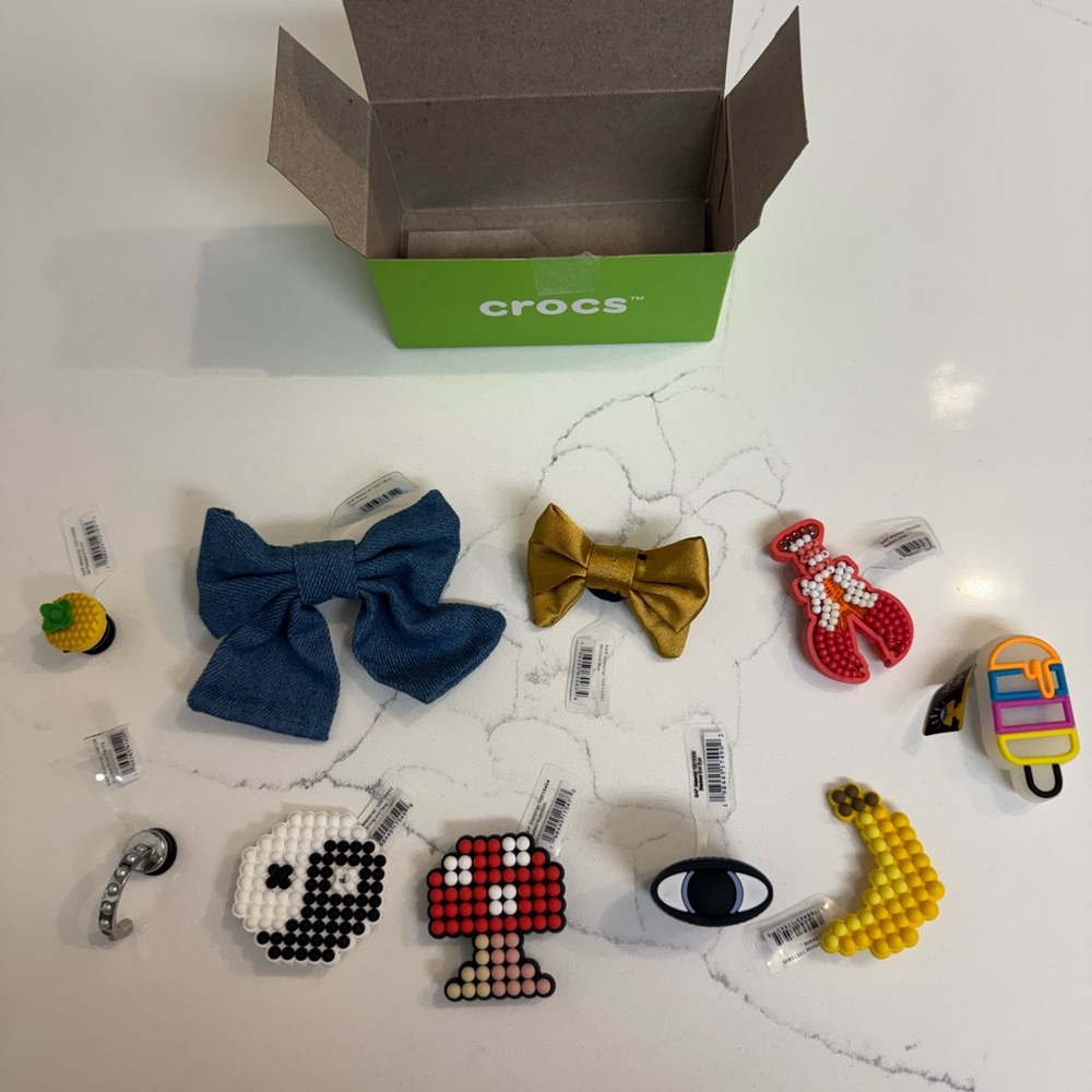 CROCS Jibbitz Charm Collection with Blue and Gold Accents